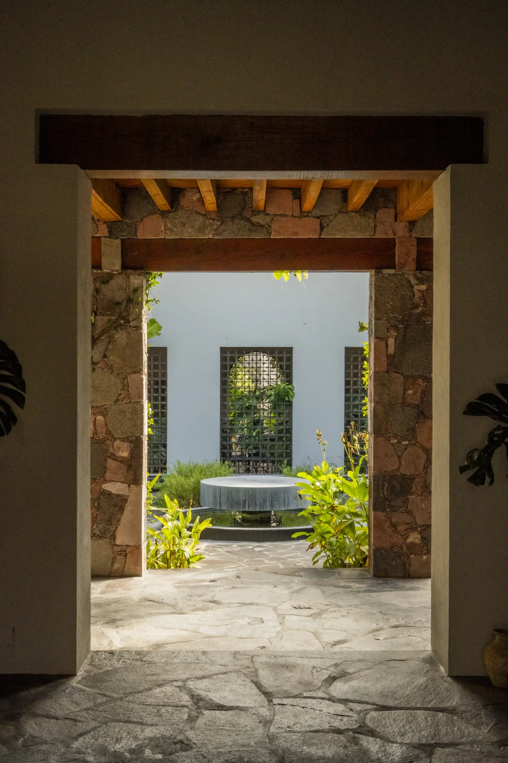 Stone, timber and the courtyard beyond.